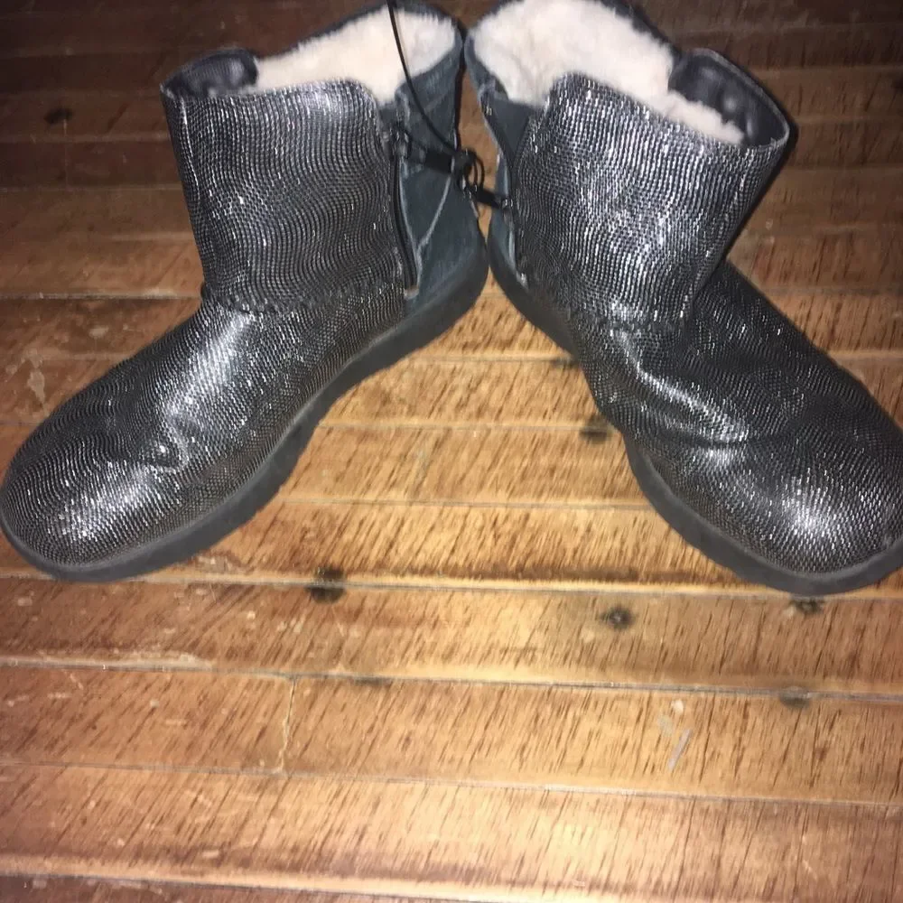 Uggs size 4 shimmery black and silver shearling lined booties